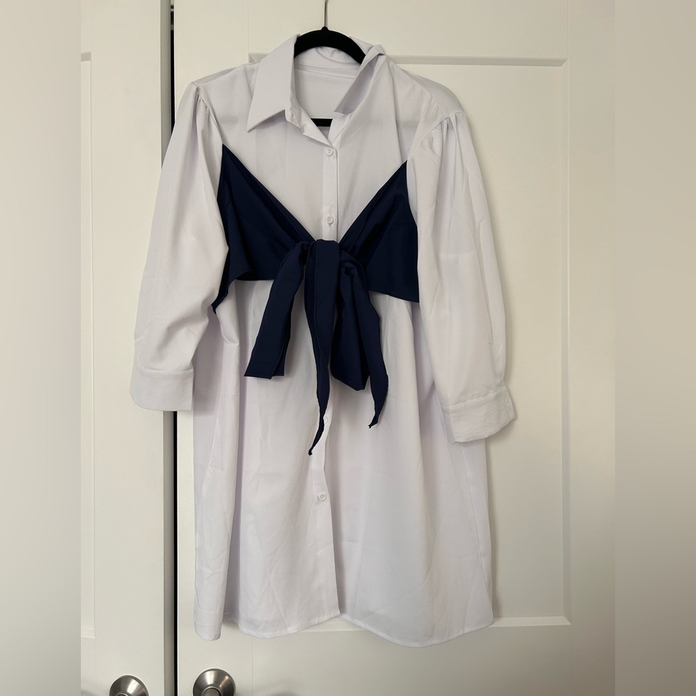 White button-up shirt dress with navy blue bow-front